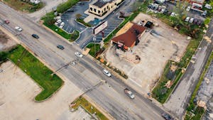 Aerial image showing storm aftermath with damaged buildings and infrastructure in Chattanooga, TN.